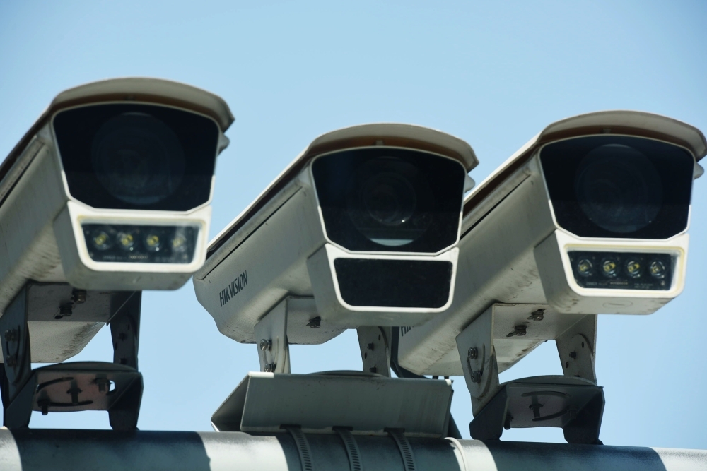 This photo taken on Wednesday shows Hikvision surveillance cameras outside the Hikvision headquarters in Hangzhou, in east China's Zhejiang province. Shares in two top Chinese surveillance firms plunged following reports Washington is considering banning them from buying US components, just as the blacklisting of telecoms giant Huawei fanned their escalating tech war. — AFP