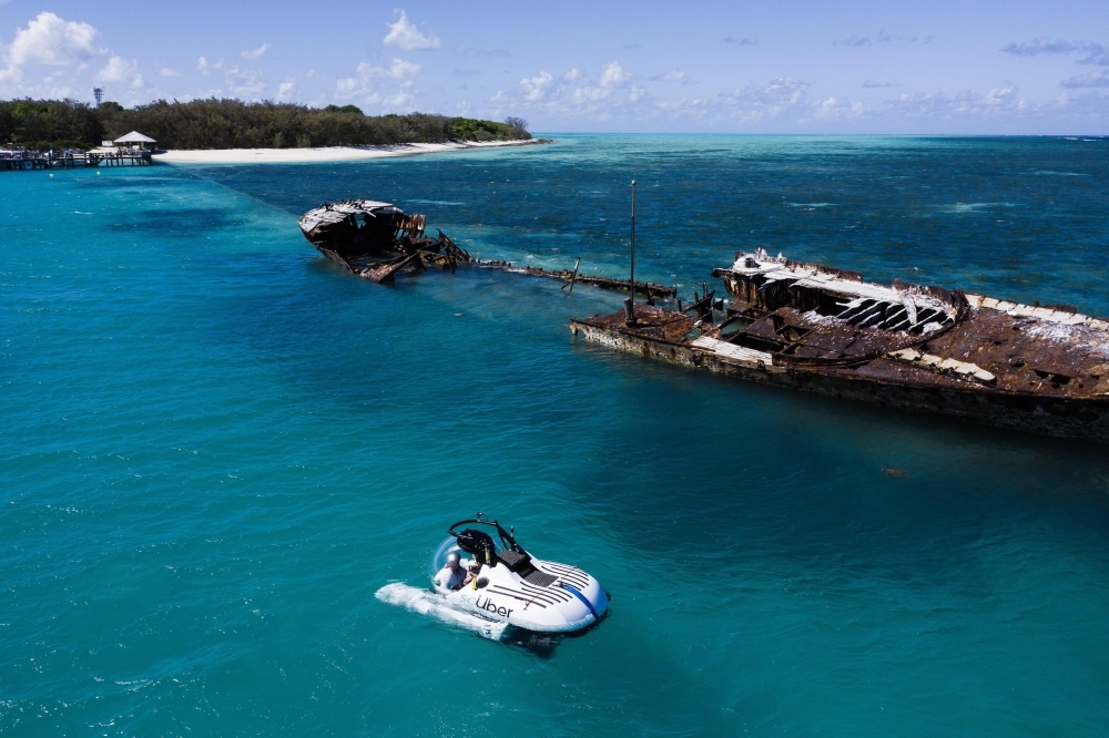 This handout photo dated Wednesday and released by ride-sharing company Uber shows a Uber submarine on the Great Barrier Reef at Heron Island in Queensland. A select few Australians will soon be able to briefly book an Uber submarine to the Great Barrier Reef, the ride-sharing giant said on Thursday. — AFP