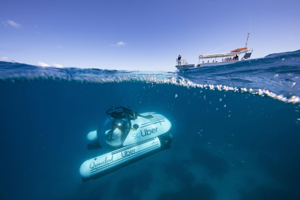 This handout photo dated Wednesday and released by ride-sharing company Uber shows a Uber submarine on the Great Barrier Reef at Heron Island in Queensland. A select few Australians will soon be able to briefly book an Uber submarine to the Great Barrier Reef, the ride-sharing giant said on Thursday. — AFP