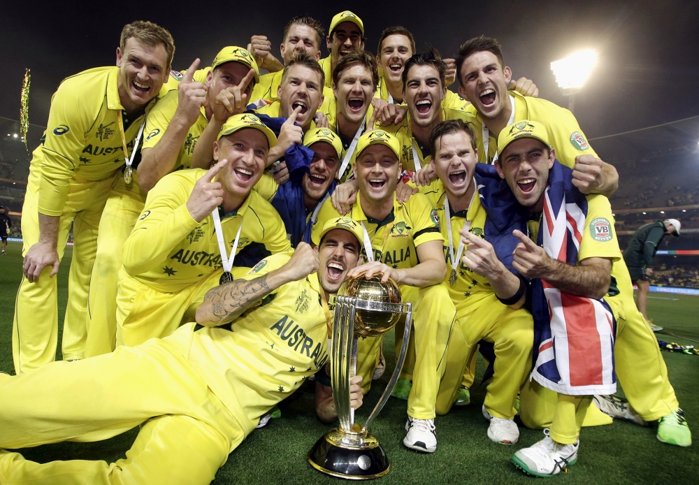 Australia's captain Michael Clarke, center, celebrates with teammates as they pose with the Cricket World Cup trophy after they defeated New Zealand in the final match at the Melbourne Cricket Ground (MCG) in this March 29, 2015 file photo. — Reuters