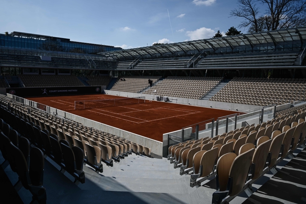 This file photo shows the new Simonne Mathieu tennis court after its inauguration ceremony at Roland Garros in Paris. After years of legal battles and threats to quit its historic home, Roland Garros will show off its new look next week, with a nod to the Eiffel Tower and a Second World War resistance fighter while boasting enough plants and greenery to make even the most demanding environmentalist drool. Ninety years after it was built, the French Open's showpiece Court Philippe Chatrier was demolished soon after the 2018 event finished. — AFP