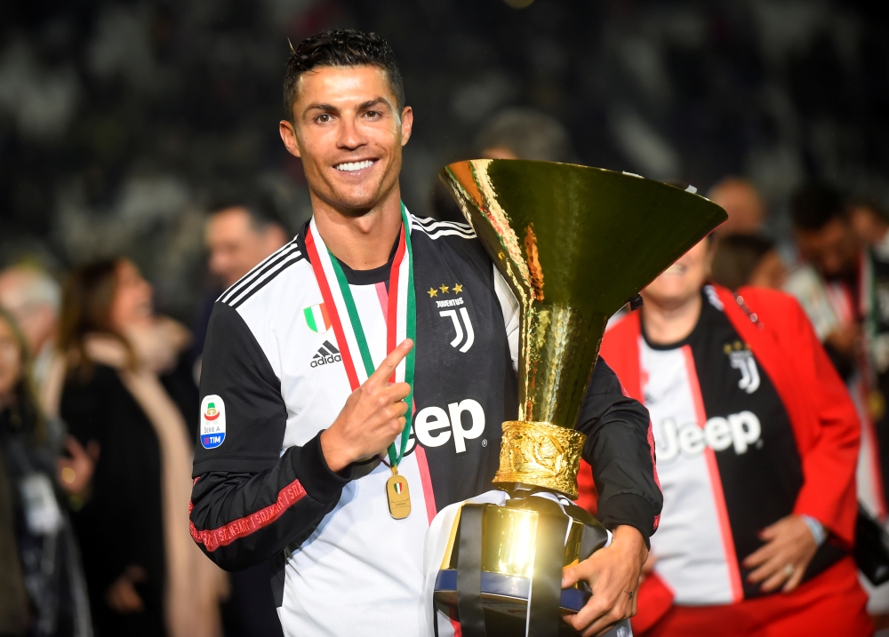 Juventus' Cristiano Ronaldo poses as he celebrates winning Serie A with the trophy at the Allianz Stadium, Turin, Italy. — Reuters
