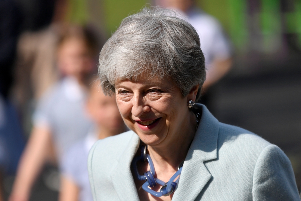 Britain's Prime Minister Theresa May arrives to vote in the European Parliament Elections, taking place despite Brexit uncertainty, in Sonning, Britain, on Thursday. — Reuters