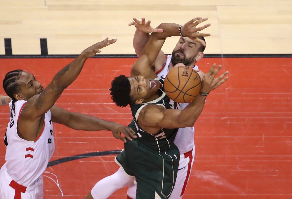 Milwaukee Bucks forward Giannis Antetokounmpo (34) battles for the ball with Toronto Raptors center Marc Gasol (33) in the fourth quarter in game three of the Eastern conference finals of the 2019 NBA Playoffs at Scotiabank Arena. — Reuters