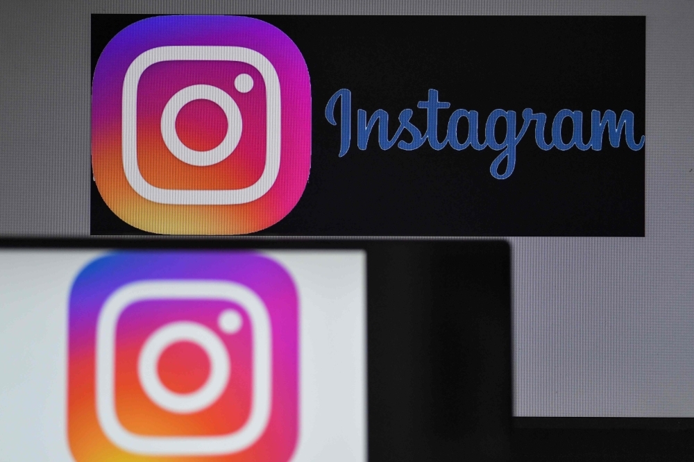 In this file photo logos of US social network Instagram are displayed on the screen of a computer and a smartphone in Nantes, western France. Instagram on Thursday said it was not the source of private contact information for millions of influential users of the service recently found in an unguarded online database. — AFP