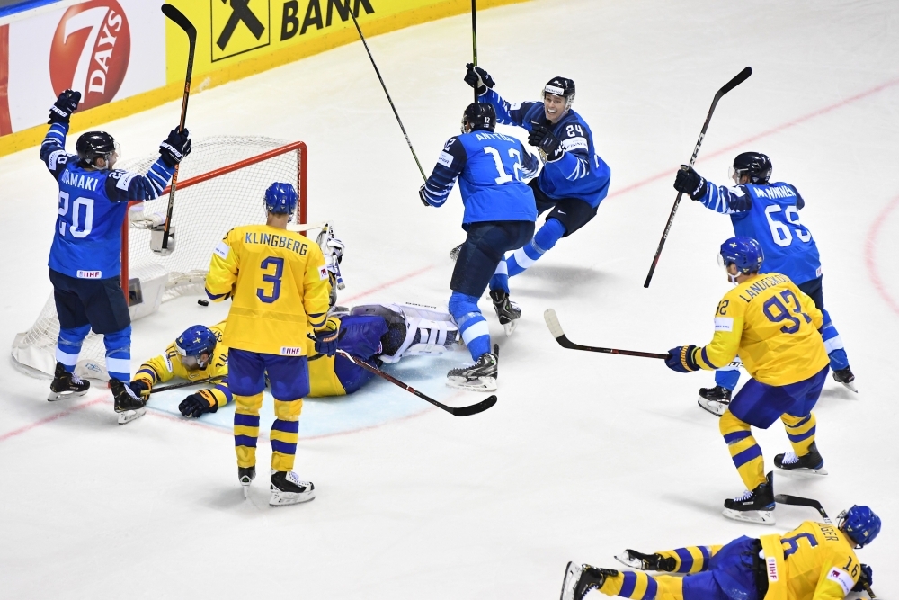 Finland's players celebrate after scoring the goal to tie at 4-4  during the IIHF Men's Ice Hockey World Championships quarter-final match between Finland and Sweden on Thursday at the Steel Arena in Kosice, Slovakia. — AFP