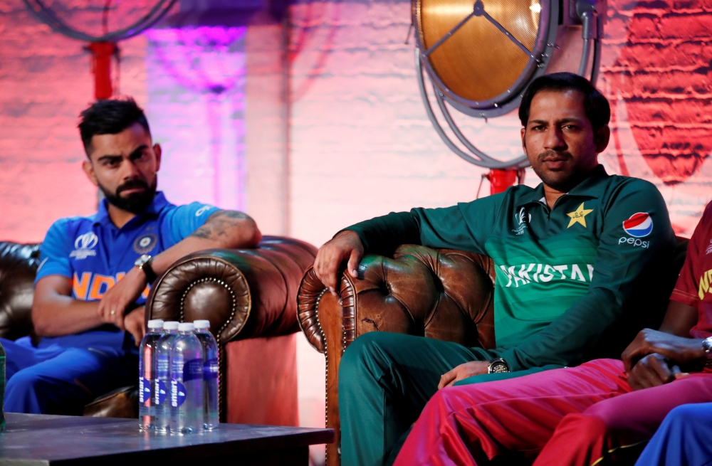 Pakistan's Sarfaraz Ahmed and India's Virat Kohli during the ICC Cricket World Cup Captains Press Conference at The Film Shed, London, Britain, on Thursday. – Reuters