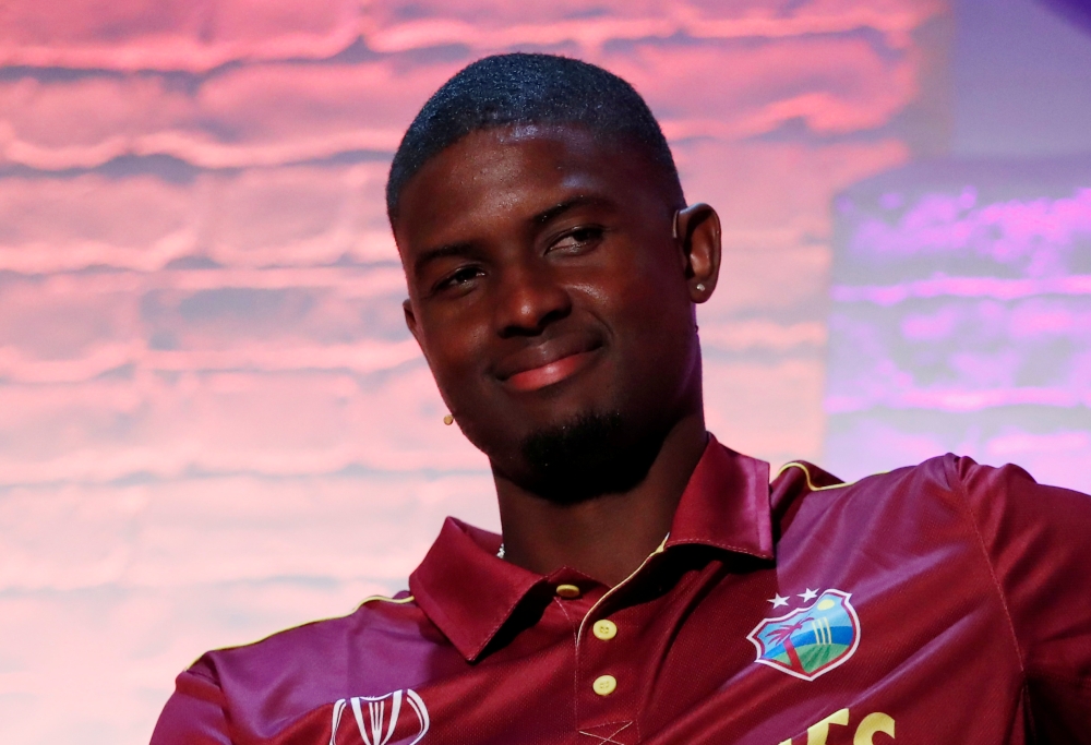 West Indies Andre Russell celebrates after winning their semifinal match against India in the World Twenty20 cricket tournament at Mumbai, India. — Reuters
