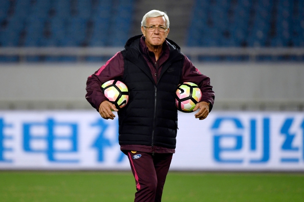 This file photo shows China's head coach Marcello Lippi attending a training session in Chongqing, southwest China, ahead of their international friendly football match against Colombia.  Lippi was back as coach of China on Friday, four months after the World Cup winner quit and following a failed stint by fellow Italian Fabio Cannavaro. — AFP