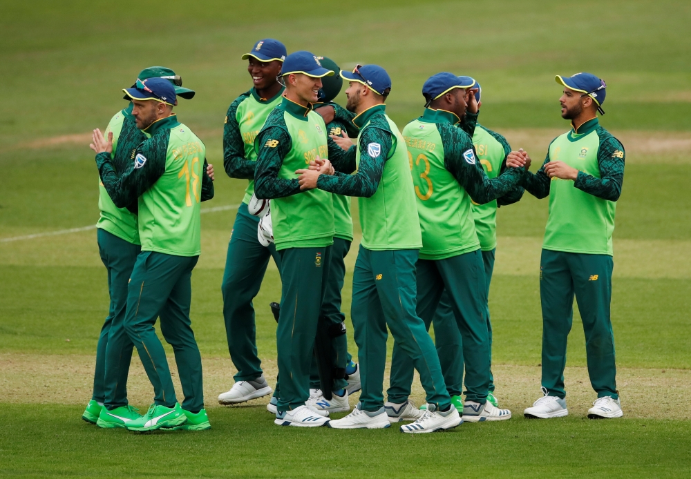 South Africa players celebrate victory   in the ICC Cricket World Cup warm-up match against Sri Lanka at the Cardiff Wales Stadium, Cardiff, Britain, on Friday. — Reuters 