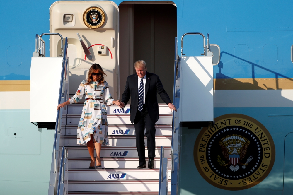 US President Donald Trump and first lady Melania Trump arrive aboard Air Force One at Tokyo Haneda Airport in Tokyo, Japan May 25.- Reuters