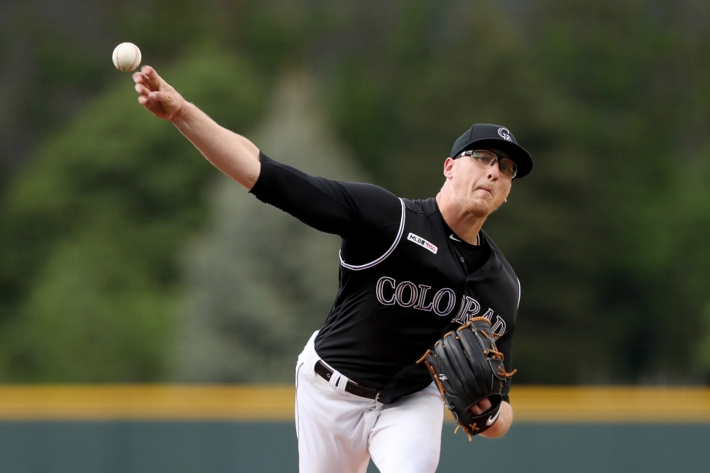 Starting pitcher Jeff Hoffman of the Colorado Rockies throws in the first inning against the Baltimore Orioles at Coors Field on Friday in Denver, Colorado. — AFP