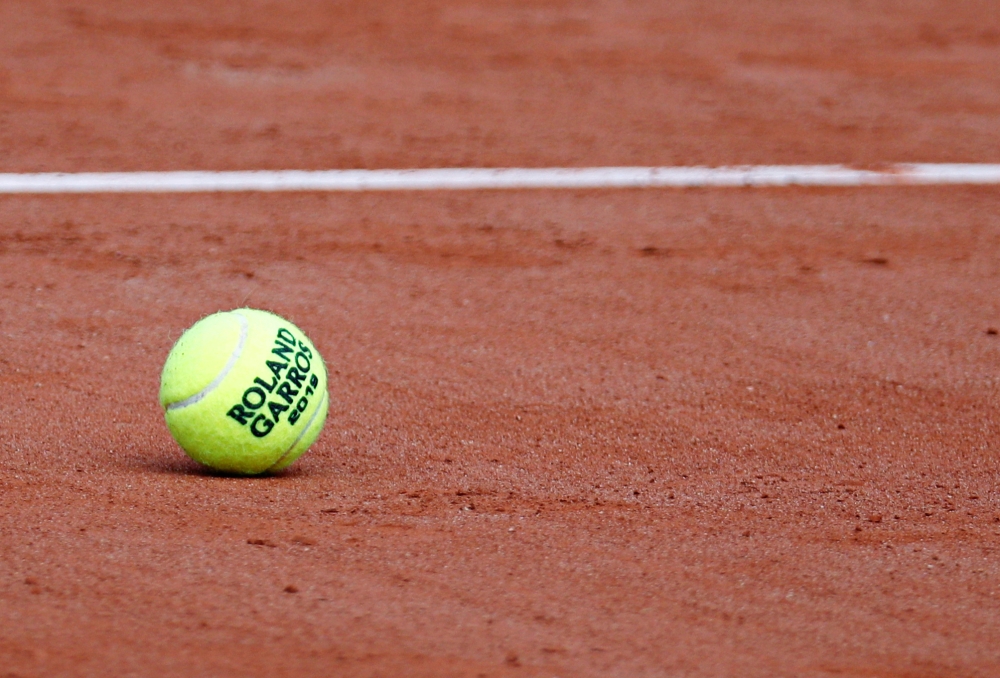 An official ball is seen on the court on the eve of the start of the French Open tournament at Roland Garros, Paris on Saturday. — Reuters