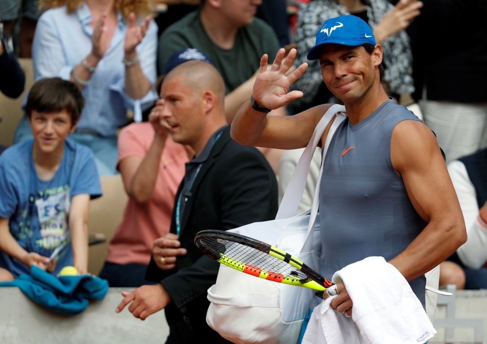 Rafael Nadal arrives to attend a training session on the eve of the start of the French Open tournament at Roland Garros in Paris, on Saturday. — Reuters