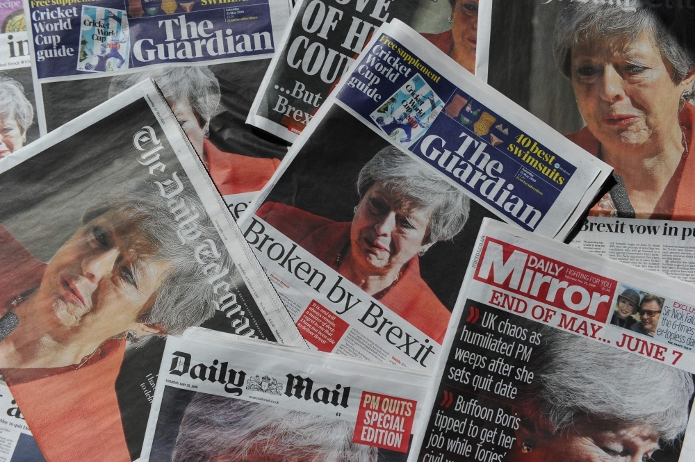 An arrangement of UK daily newspapers photographed as an illustration in London on Saturday shows front page headlines reporting on the resignation speech of Britain's Prime Minister Theresa May.  Beleaguered British Prime Minister Theresa May announced on Friday that she will resign on June 7 following a Conservative Party mutiny over her remaining in power. All the UK papers carried the story on their front pages with headlines like the Guardian's 