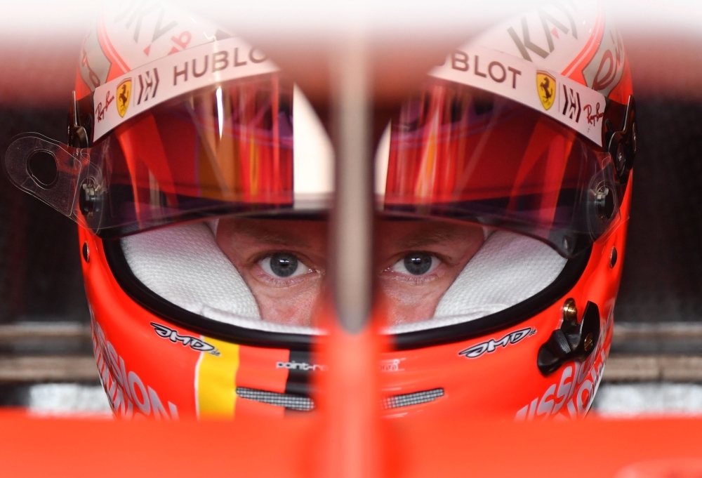 Ferrari's German driver Sebastian Vettel looks on in his car in the pits during the third practice session at the Monaco street circuit on Saturday in Monaco, ahead of the Monaco Formula 1 Grand Prix.  — AFP