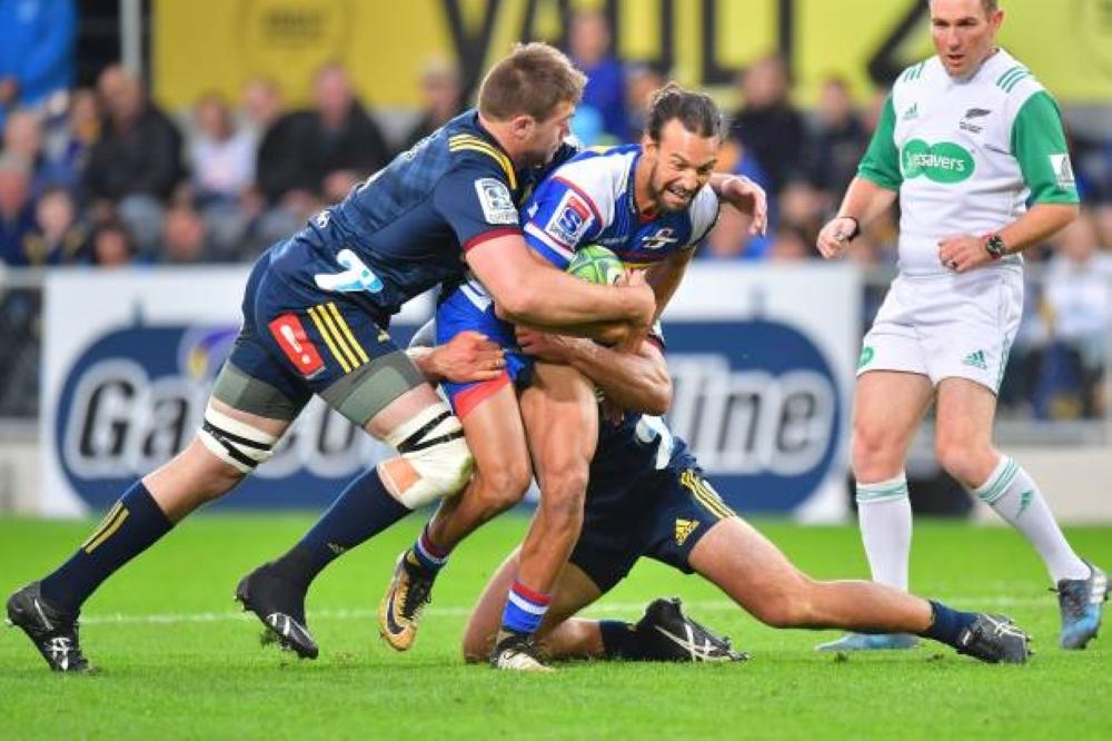 Stormers' Dillyn Leyds, center, is tackled by Highlanders' Liam Squire, left, and Siate Tokolahi, back during the Super Rugby match between New Zealand's Otago Highlanders and South Africa's Western Stormers at Forsyth Barr Stadium in Dunedin, New Zealand, in this March 9, 2018 file photo. — AFP