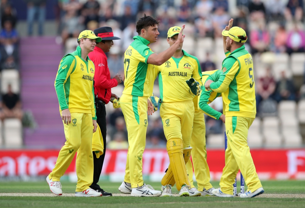 Australia's Marcus Stoinis celebrates running out England's Chris Woakes during a warm-up against England, in Southampton, Britain, on Saturday. — Reuters