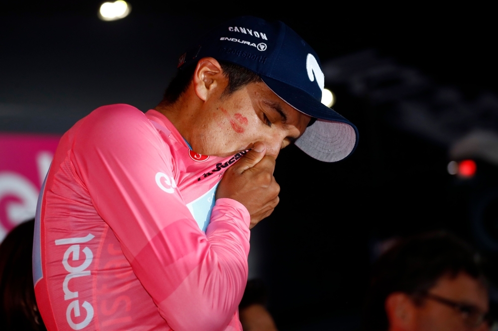 Team Movistar rider Ecuador's Richard Carapaz celebrates with the pink jersey of overall leader during the podium ceremony of stage 14 of the 102nd Giro d'Italia — Tour of Italy — cycle race, from Saint-Vincent to Courmayeur, Italy, on Saturday. — AFP