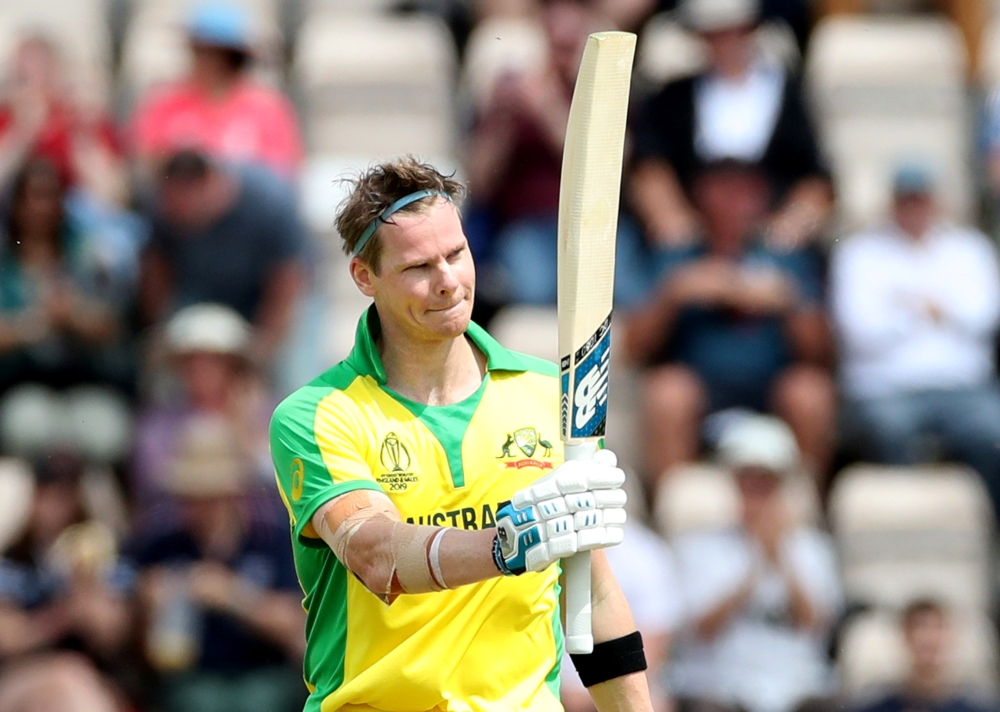 Australia's Steve Smith celebrates his century in the World Cup warm-up match against England in Southampton, on Saturday. — Reuters 