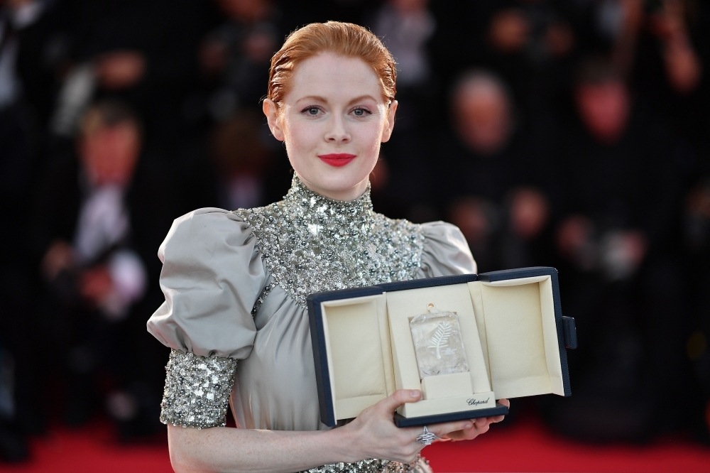 British actress Emily Beecham poses during a photo-call with her trophy after she won the Best Actress Prize for her part in 