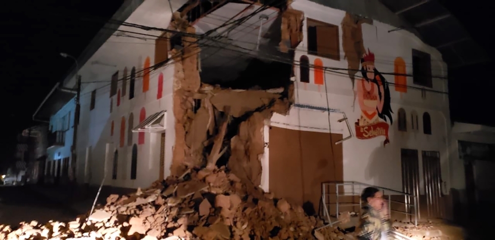 Handout picture released by the Peruvian Fire Department showing a house damaged by an 8.0 earthquake in Yurimaguas, Peru, early on Sunday. — AFP