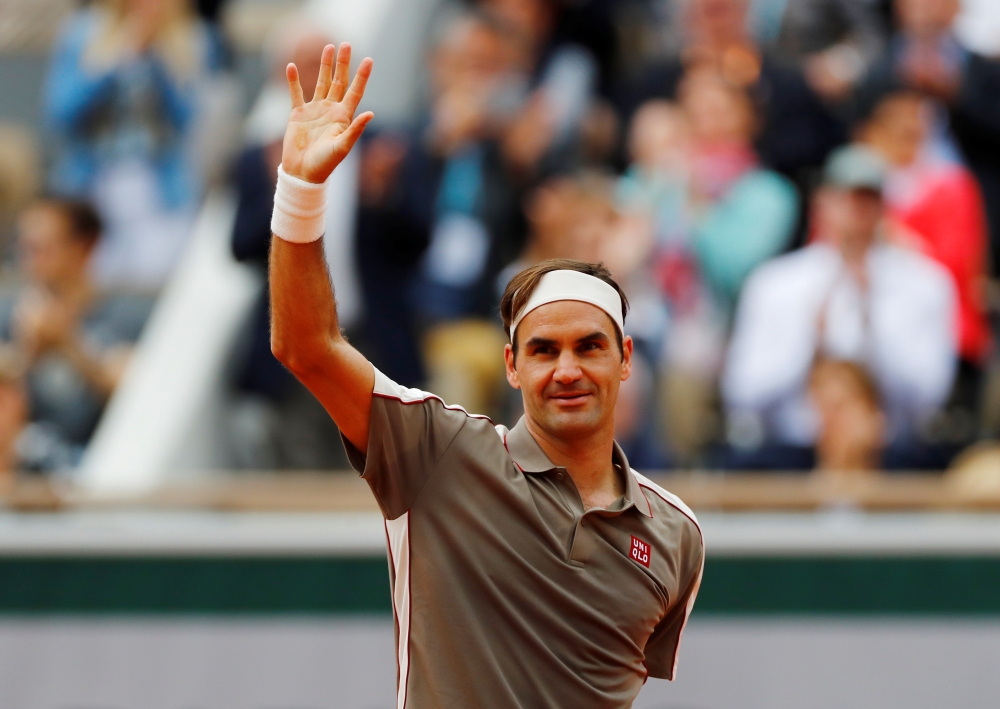 Switzerland's Roger Federer celebrates winning his first round match against Italy's Lorenzo Sonego at Roland Garros, Paris, on Sunday. — Reuters