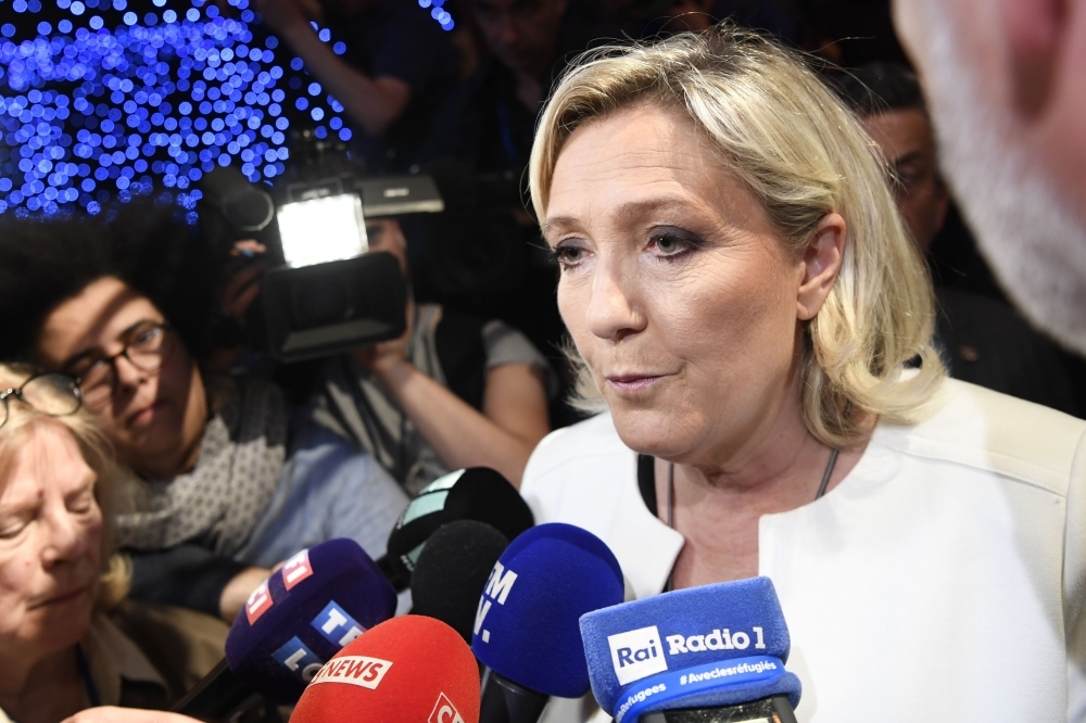 French far-right Rassemblement National (RN) President and member of Parliament Marine Le Pen speaks to the press after the announcement of initial results during an RN election-night event for European parliamentary elections at La Palmeraie venue in Paris on Sunday. — AFP