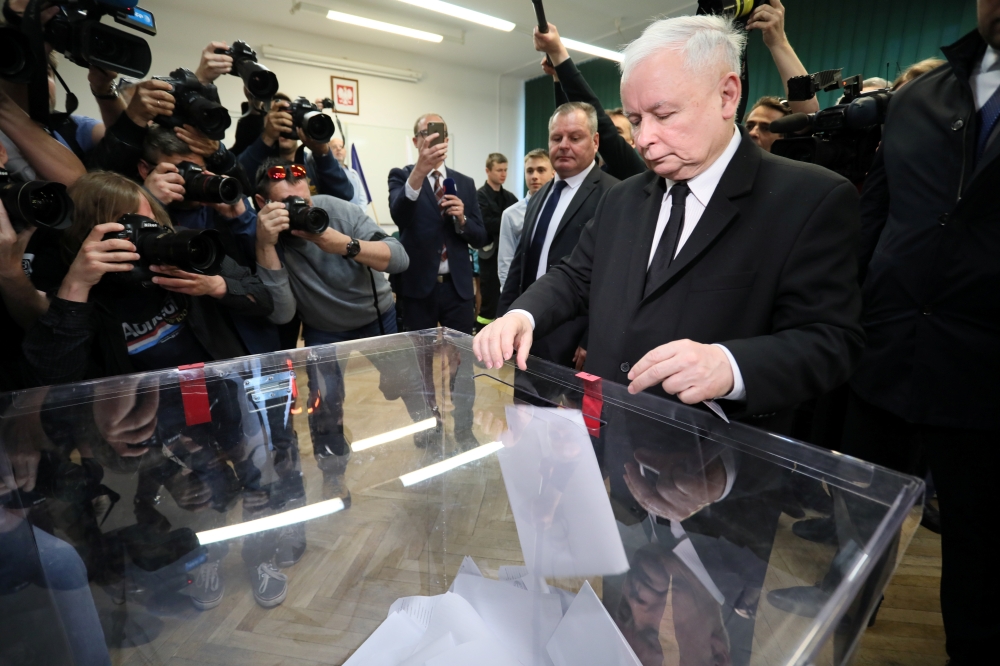 Jaroslaw Kaczynski, leader of the ruling Law and Justice (PiS) party, casts his vote during the European Parliament elections at a polling station in Warsaw, Poland, on Sunday. — Reuters