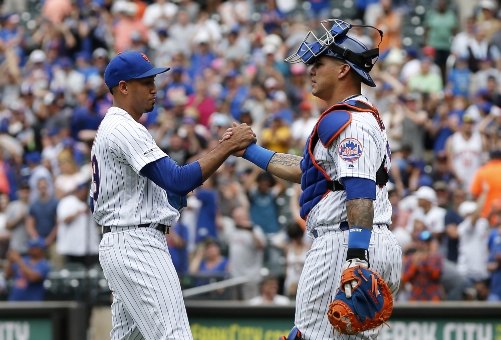 Edwin Diaz #39 and Wilson Ramos #40 of the New York Mets celebrate after defeating the Detroit Tigers at Citi Field in New York City on Sunday. — AFP