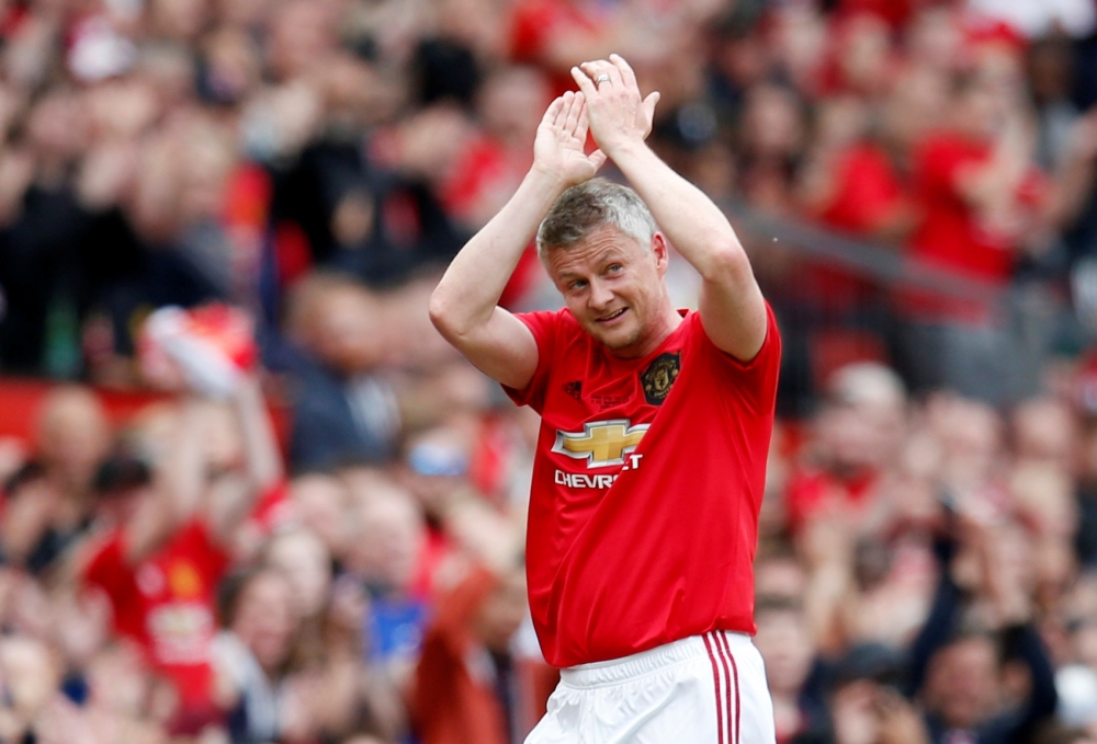 Manchester United's Ole Gunnar Solskjaer applauds the fans as he is substituted during a match between Manchester United '99 Legends vs Bayern Munich Legends1999 at Old Trafford, Manchester, Britain, on Sunday. — Reuters