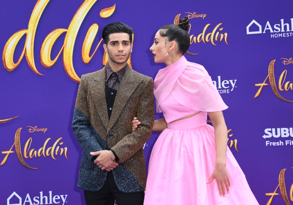 Canadian actor Mena Massoud and British actress Naomi Scott attend the World Premiere of Disney’s “Aladdin” at El Capitan theater in Hollywood. — AFP
