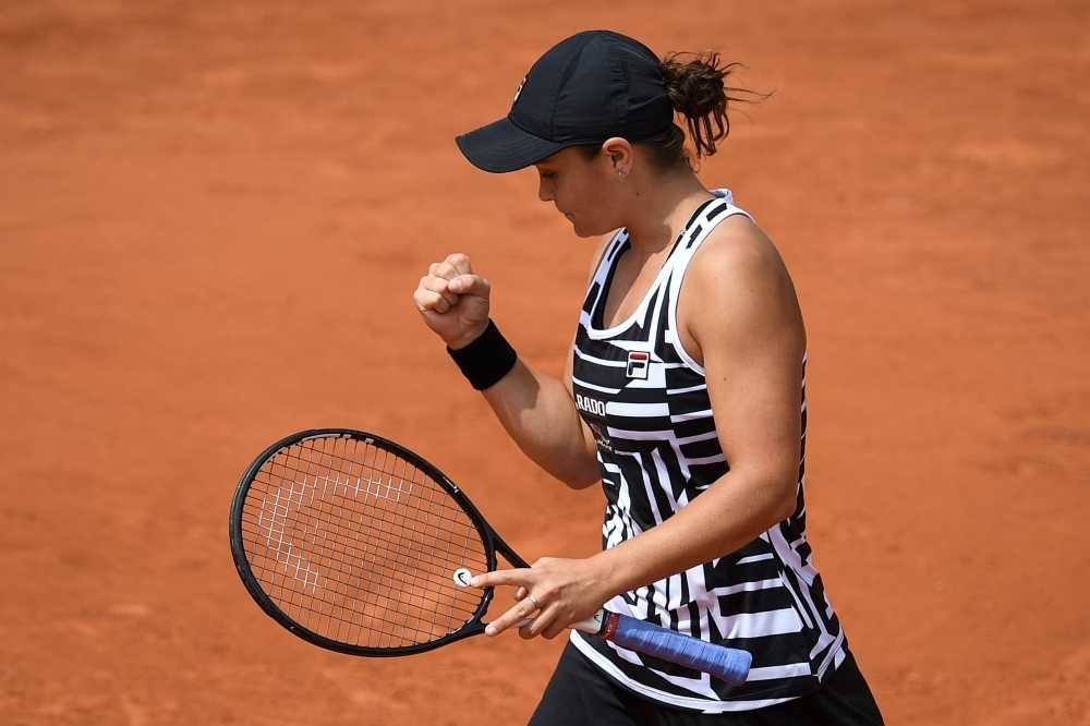 Australia's Ashleigh Barty celebrates after winning against Jessica Pegula of the US in their women's singles first round match on day two of The Roland Garros 2019 French Open tennis tournament in Paris on Monday. — AFP