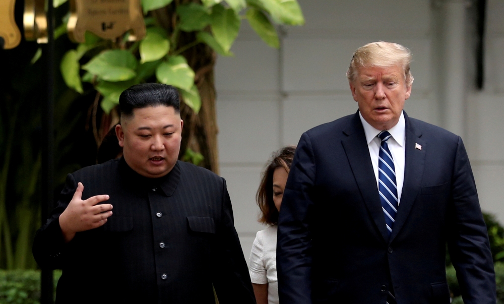 North Korea's leader Kim Jong Un and US President Donald Trump talk in the garden of the Metropole hotel during the second North Korea-US summit in Hanoi, Vietnam, in this Feb. 28, 2019 file photo. — Reuters