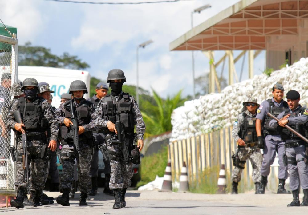 Policemen are seen during a riot in a prison in Brazilian state of Amazonas in Manaus, Brazil, on Sunday. — Reuters