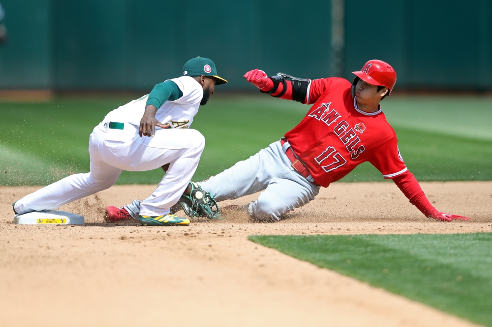 Los Angeles Angels designated hitter Shohei Ohtani (17) is tagged out by Oakland Athletics second baseman Jurickson Profar (23) on a steal attempt during the seventh inning at Oakland Coliseum, on Monday. — Reuters