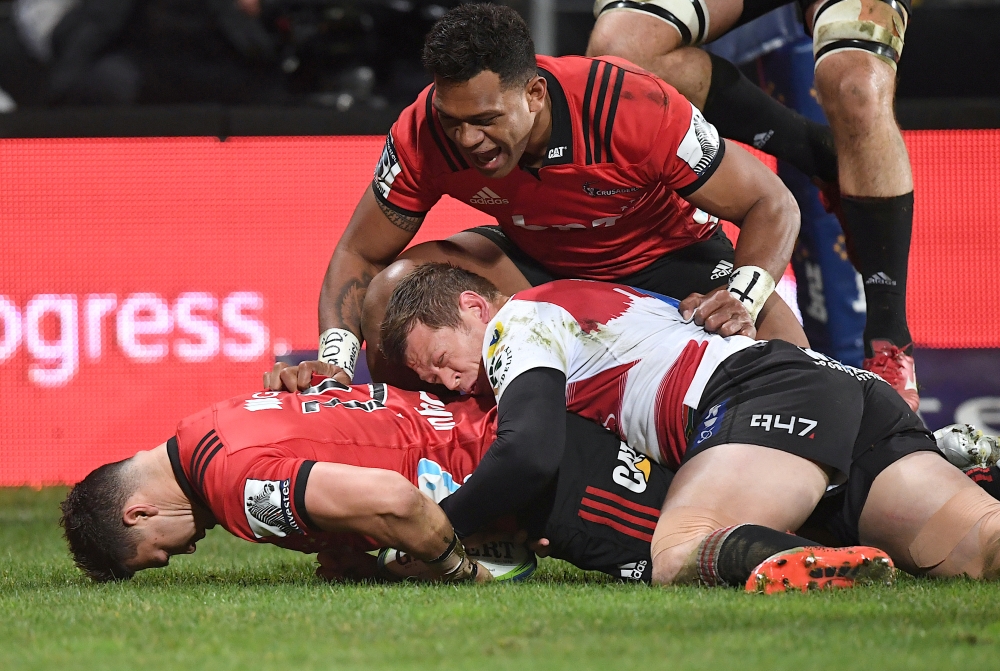 FILE PHOTO: Rugby Union - Super Rugby Final - Crusaders vs Lions - AMI Stadium, Christchurch, New Zealand - August 4, 2018 - David Havili of the Canterbury Crusaders scores a try as he is tackled by Ruan Combrinck of South Africa's Lions.   REUTERS/Stringer/File Photo