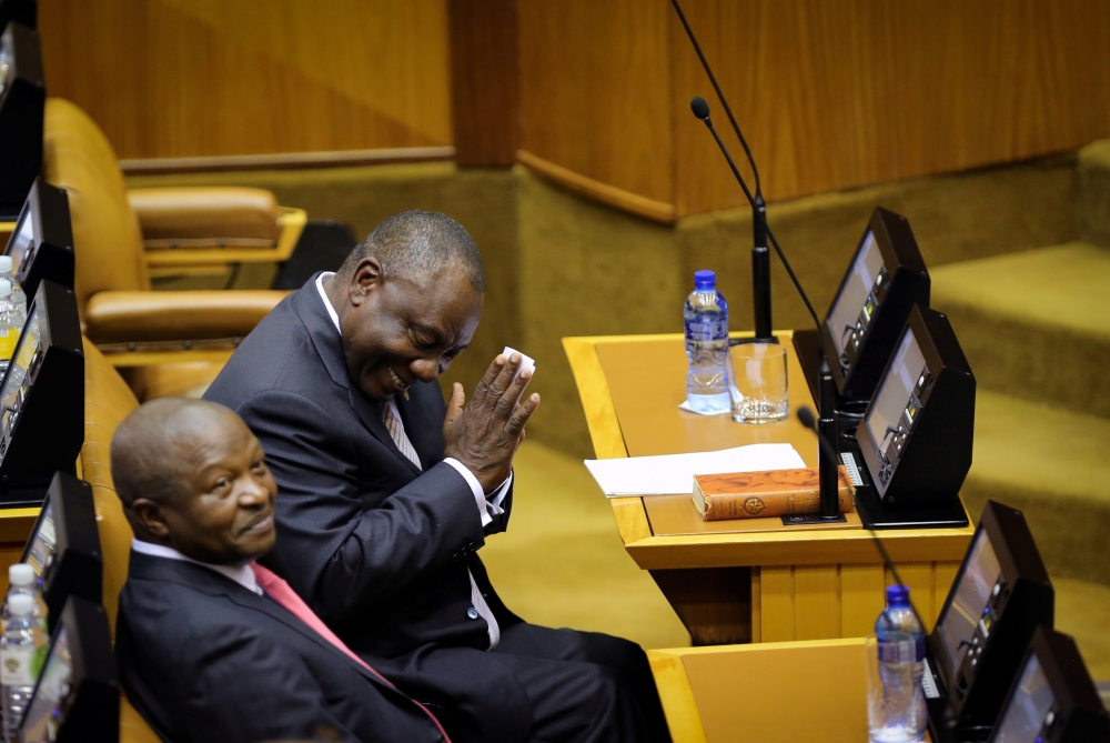 South African President Cyril Ramaphosa gestures next to his deputy David Mabuza at Parliament in Cape Town, South Africa, in this file photo. — Reuters