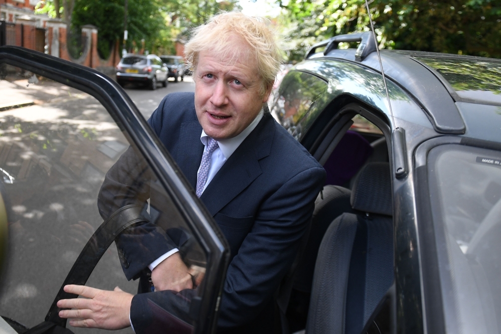 Conservative MP Boris Johnson leaves his residence in south London on Tuesday. — AFP