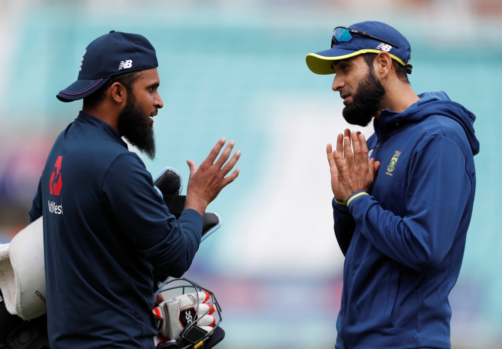 England's Jofra Archer talks with Eoin Morgan during nets prior to the ICC Cricket World Cup clash at the Kia Oval, London, Britain, on  Wednesday. — Reuters
