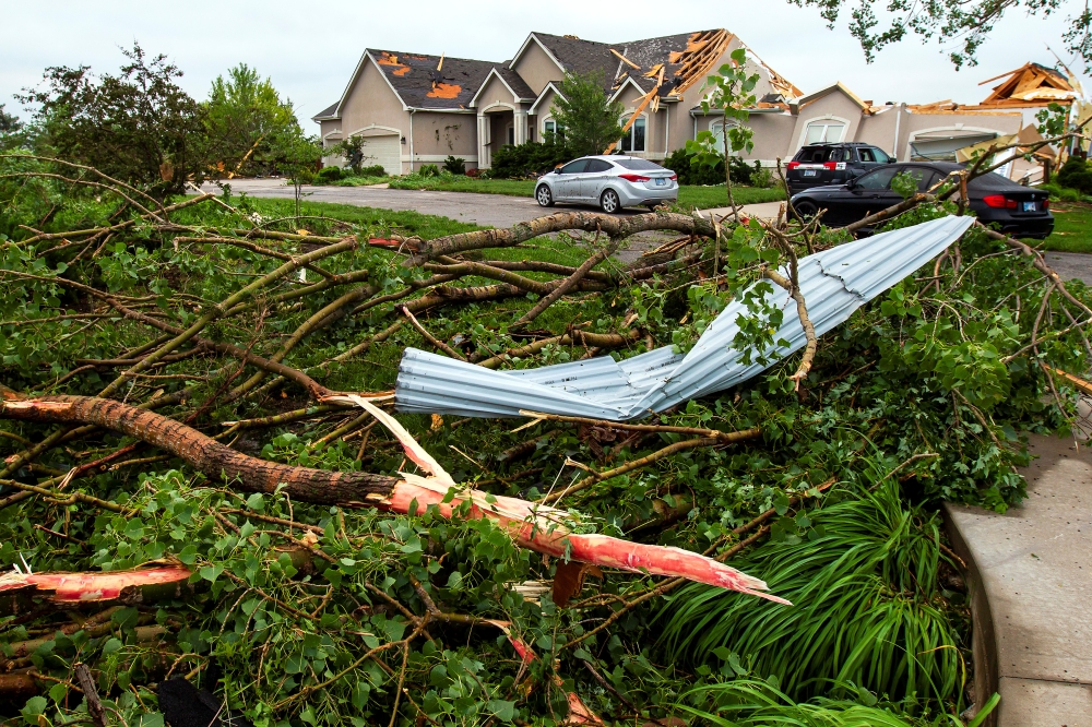 A tornado toppled trees and power lines in much of the city of Linwood on Tuesday in Linwood, Kansas. The Midwest has seen extensive severe weather this spring with widespread flooding and multiple tornadoes. — AFP