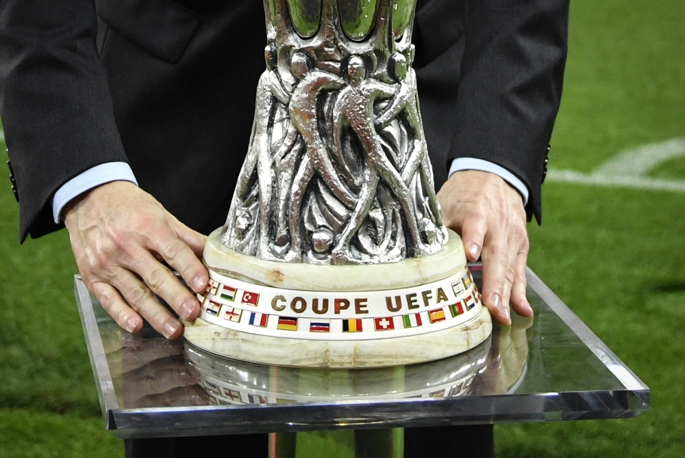 An UEFA official positions the trophy prior to the UEFA Europa League final football match between Chelsea FC and Arsenal FC at the Baku Olympic Stadium in Baku, Azerbaijian on Wednesday. — AFP