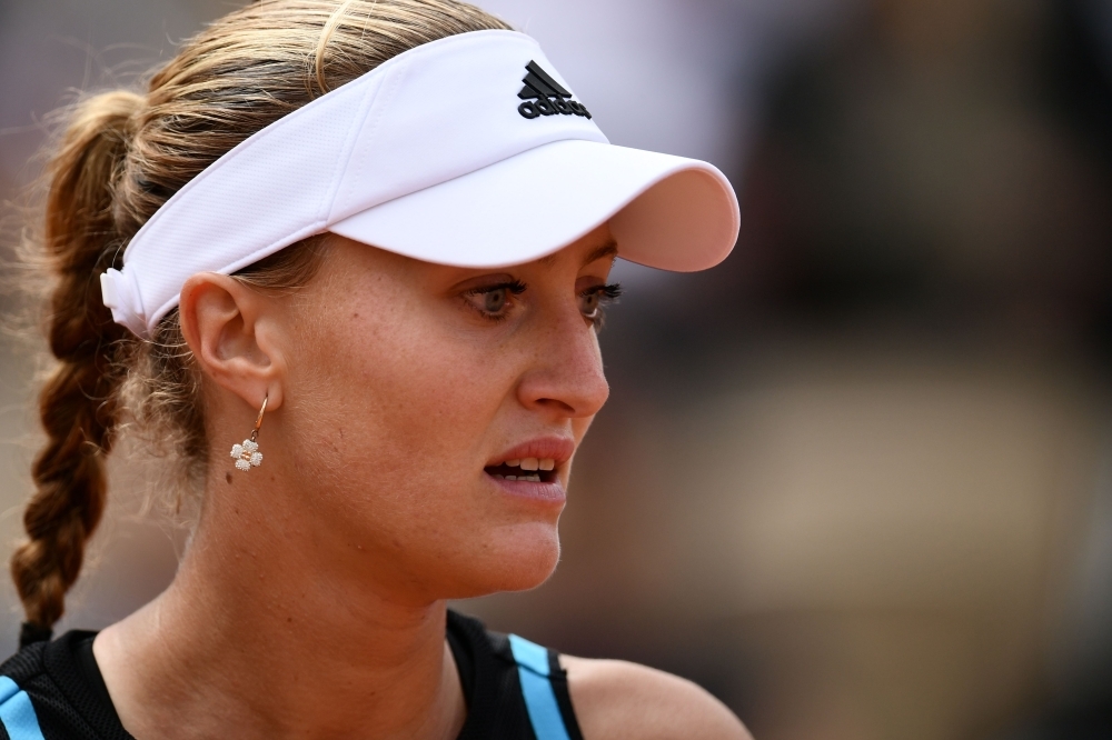 France's Kristina Mladenovic reacts during her women's singles second round match against Croatia's Petra Martic on day four of The Roland Garros 2019 French Open tennis tournament in Paris on May 29, 2019. / AFP / Philippe LOPEZ
