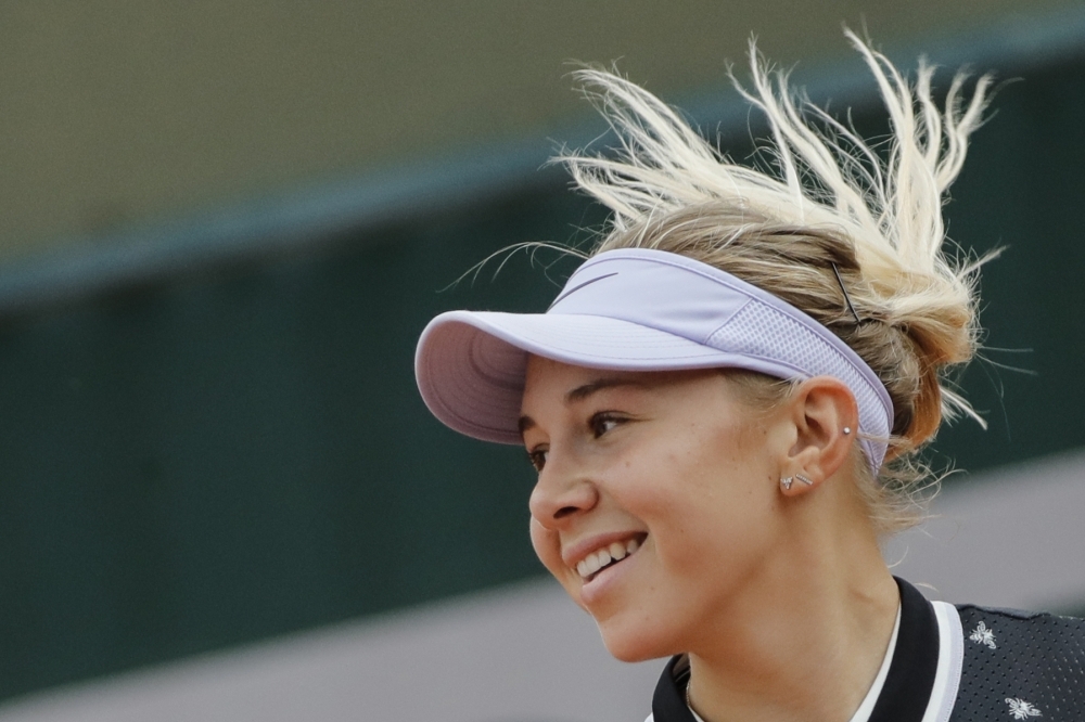 Poland's Iga Swiatek serves the ball to China's Qiang Wang during their women's singles second round match on day five of The Roland Garros 2019 French Open tennis tournament in Paris on Thursday. — AFP