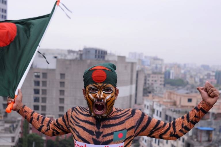 Colorful cricket superfan Shoyab Ali has had to deploy a full arsenal as he follows his beloved Bangladesh around the globe. — AFP