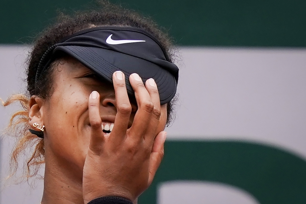 Belarus' Victoria Azarenka reacts during her second round match against Japan's Naomi Osaka during the French Open at the Roland Garros, Paris, France, on Thursday. — Reuters