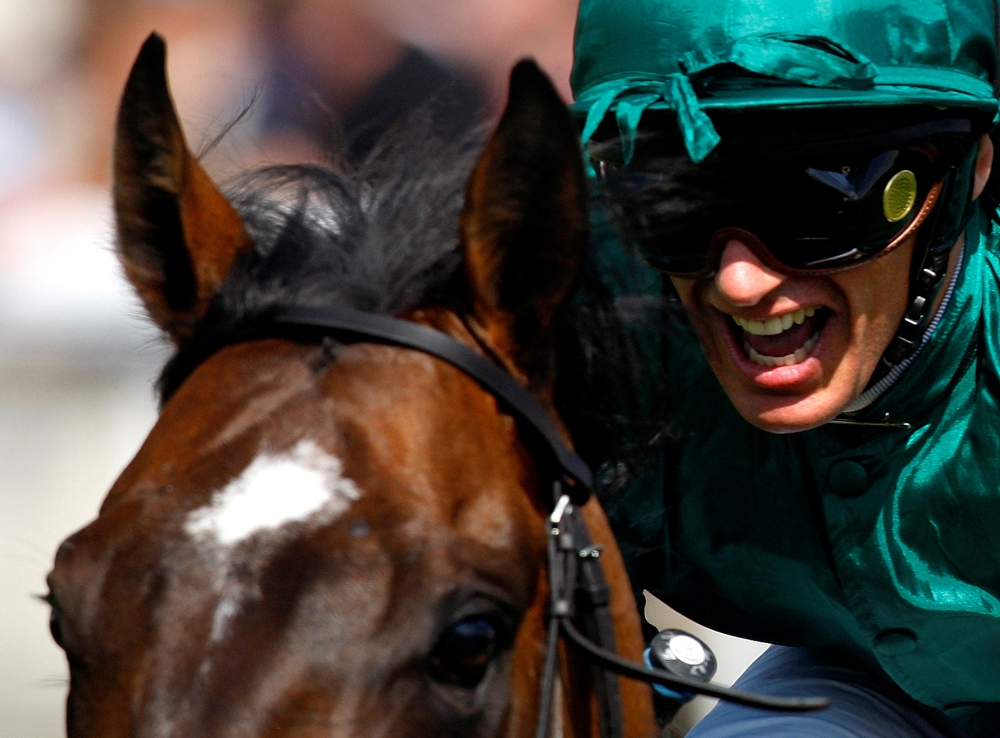 Frankie Dettori riding Authorized celebrates winning the 2007 Epsom Derby at the Epsom Downs race course in the south of England June 2, 2007. — Reuters