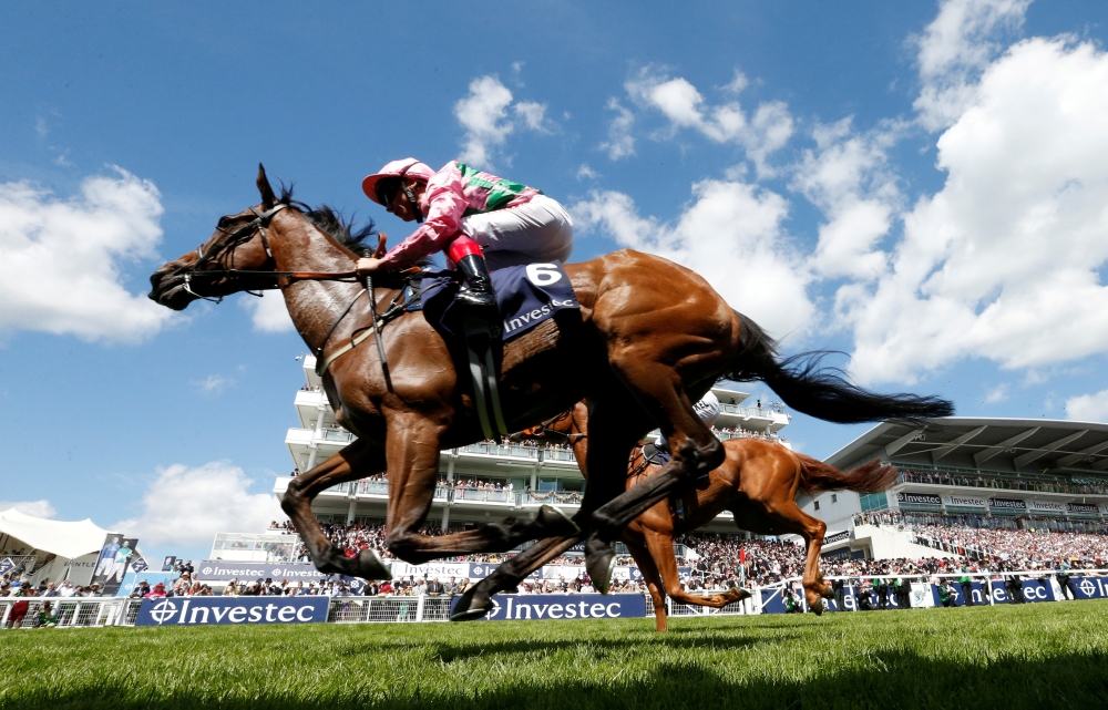Frankie Dettori riding Authorized celebrates winning the 2007 Epsom Derby at the Epsom Downs race course in the south of England June 2, 2007. — Reuters