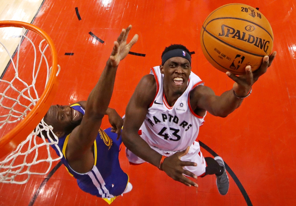 Toronto Raptors forward Pascal Siakam (43) shoots the ball against Golden State Warriors forward Draymond Green (23) in game one of the 2019 NBA Finals at Scotiabank Arena.— Reuters
