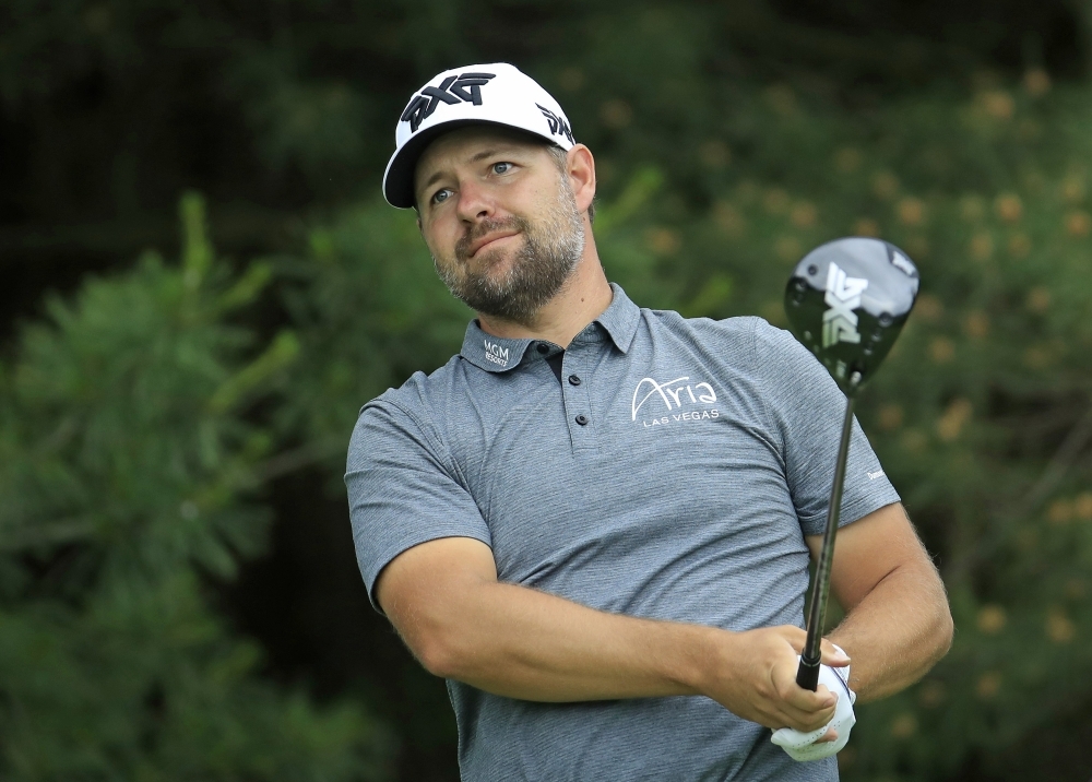 Ryan Moore watches his tee shot on the 17th hole during the first round of The Memorial Tournament Presented by Nationwide at Muirfield Village Golf Club on Thursday in Dublin, Ohio. — AFP